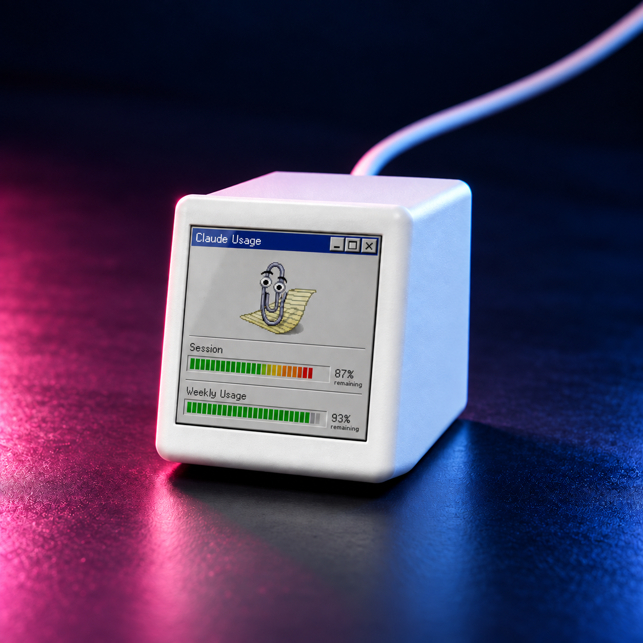 Close-up of VibeTV with the Clippy theme in pink and blue desk lighting